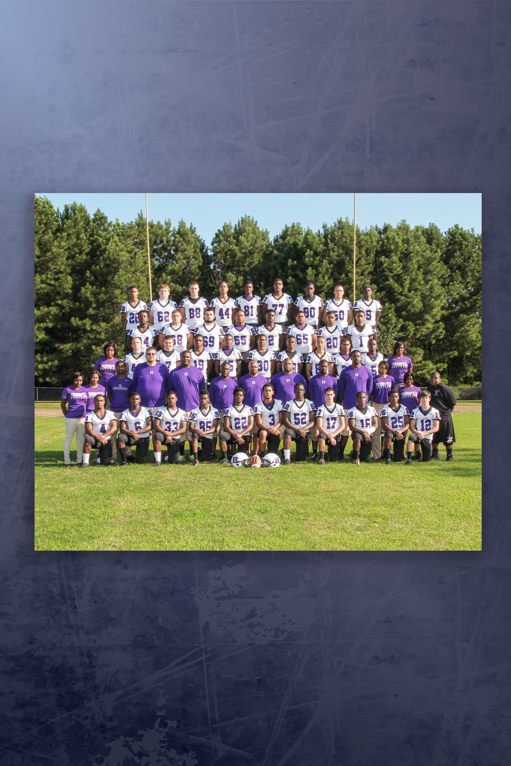 An image of a football team posing for a picture.